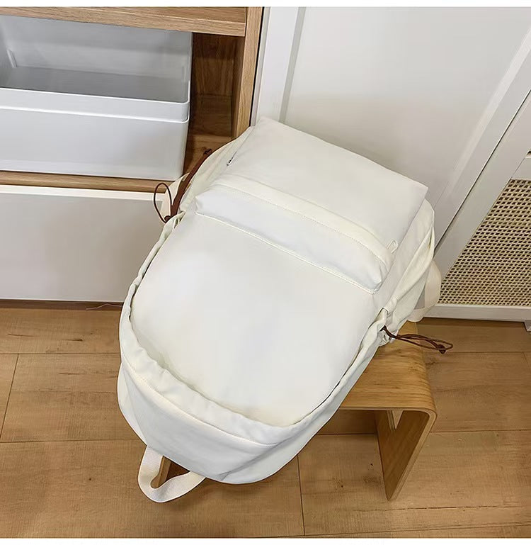 Simple solid color large capacity backpack E1335